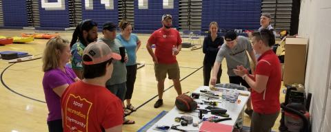 Volunteers and staff working with tools
